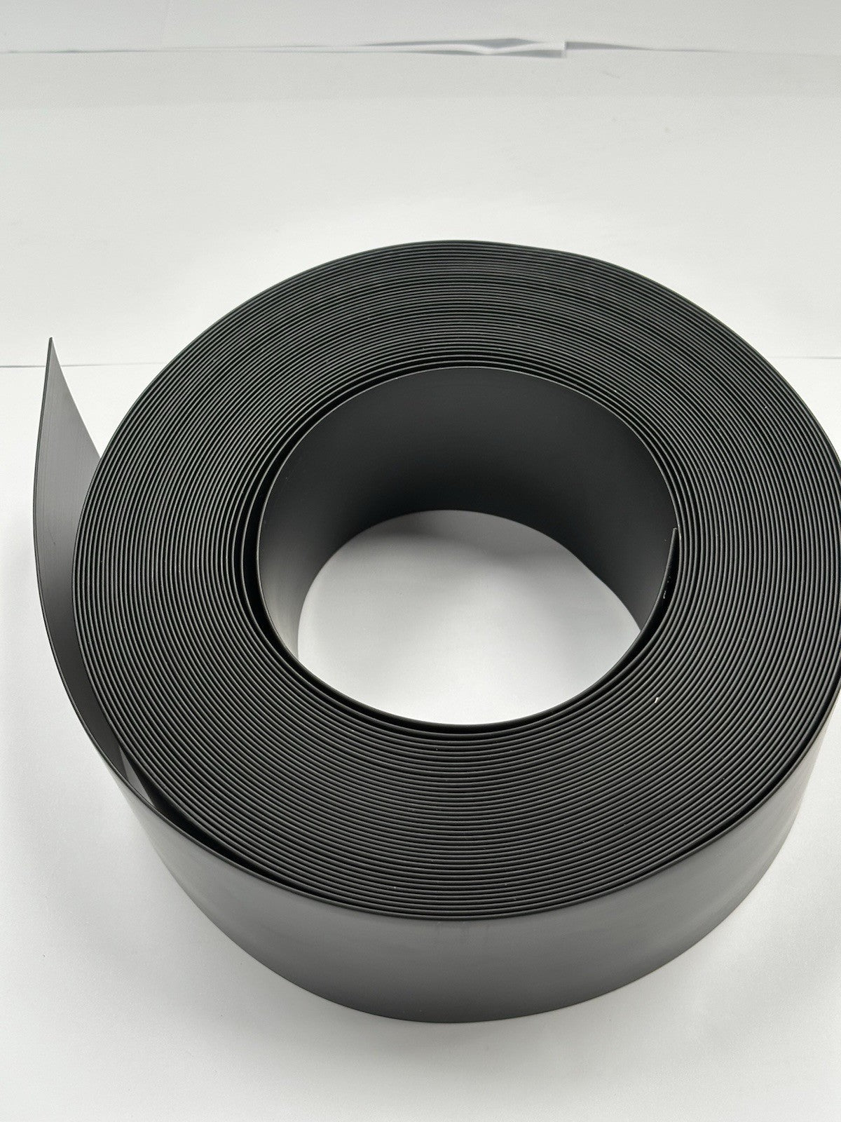 BLACK FLEXIBLE PVC FLAT SKIRTING BOARD 100mm Wide 25m roll. PREMIUM GRADE
